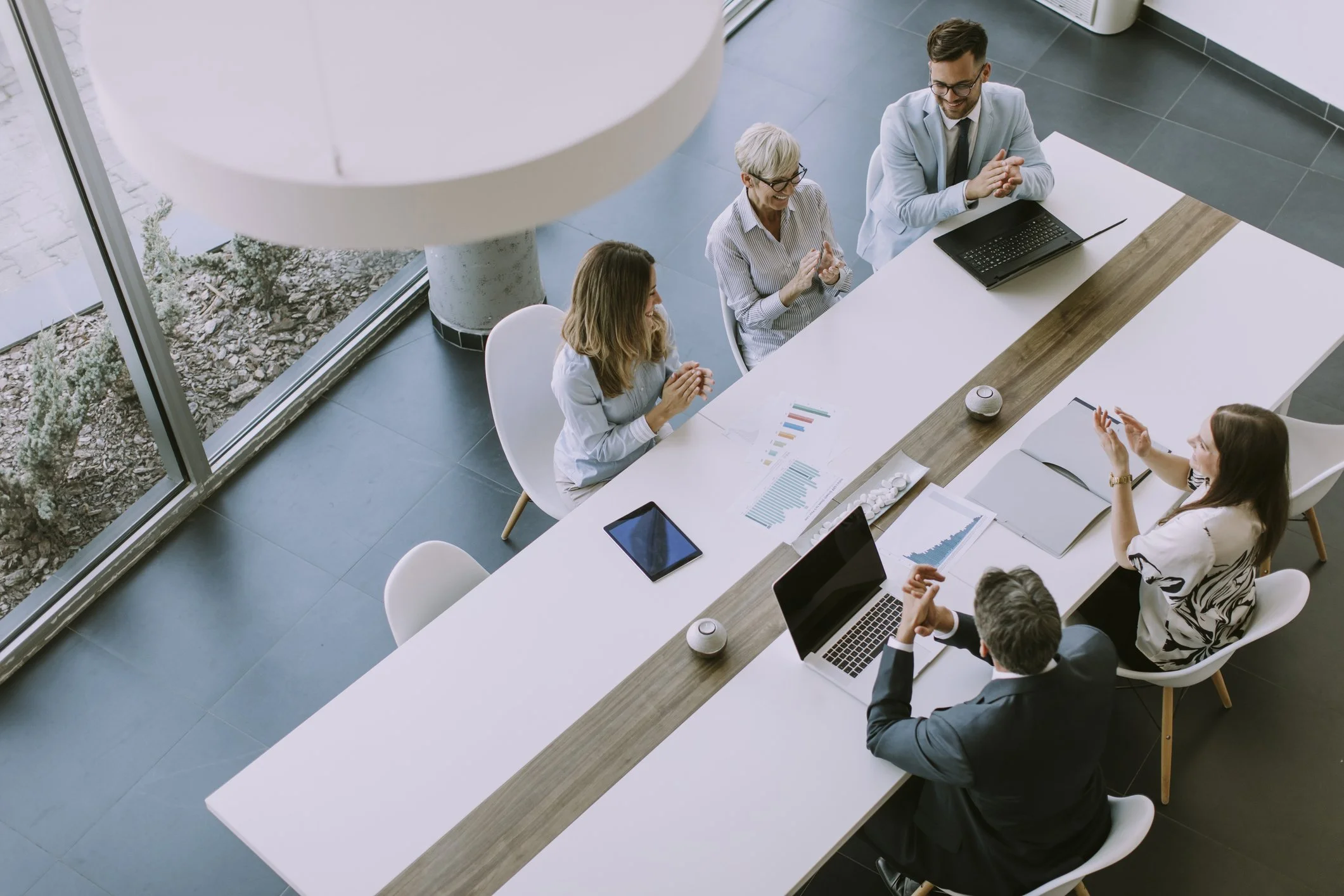 A leadership team meeting around a conference table